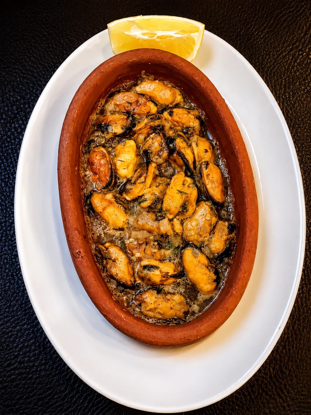 Seafood in a terracotta dish