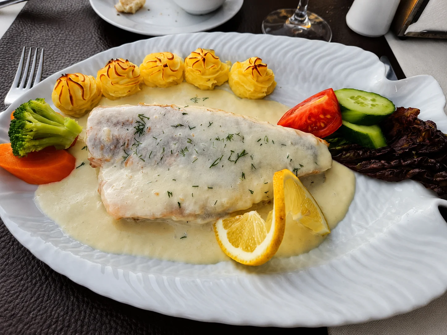 Fish dish on a shell plate